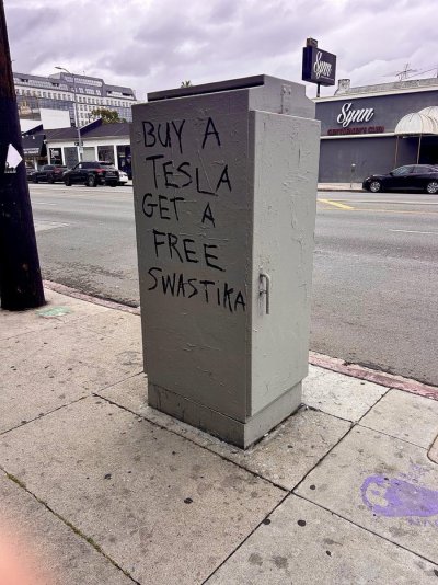 Free hooked cross for your tesla.jpg