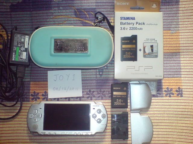 Sony PSP Slim & Lite Handheld Game Console - Ice Silver