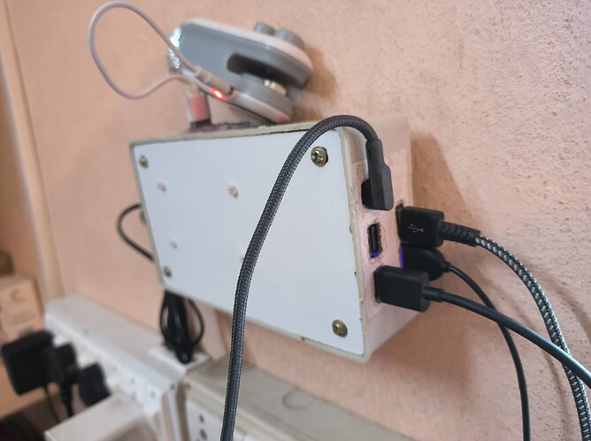 USB power hub in use hanged on a wall